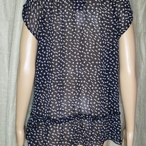 Black and white top. Size L. The brand is Fire and is 100% polyester. - Picture 4 of 4
